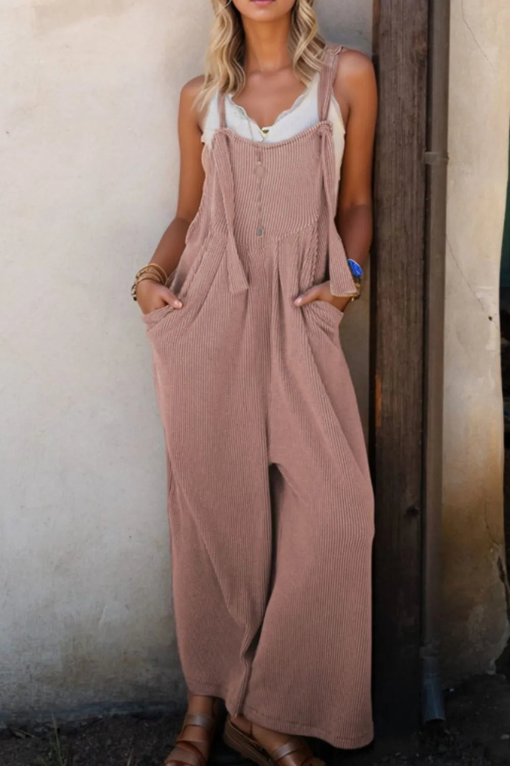 Dusty mauve loose wide-leg overalls with adjustable shoulder straps and deep pockets