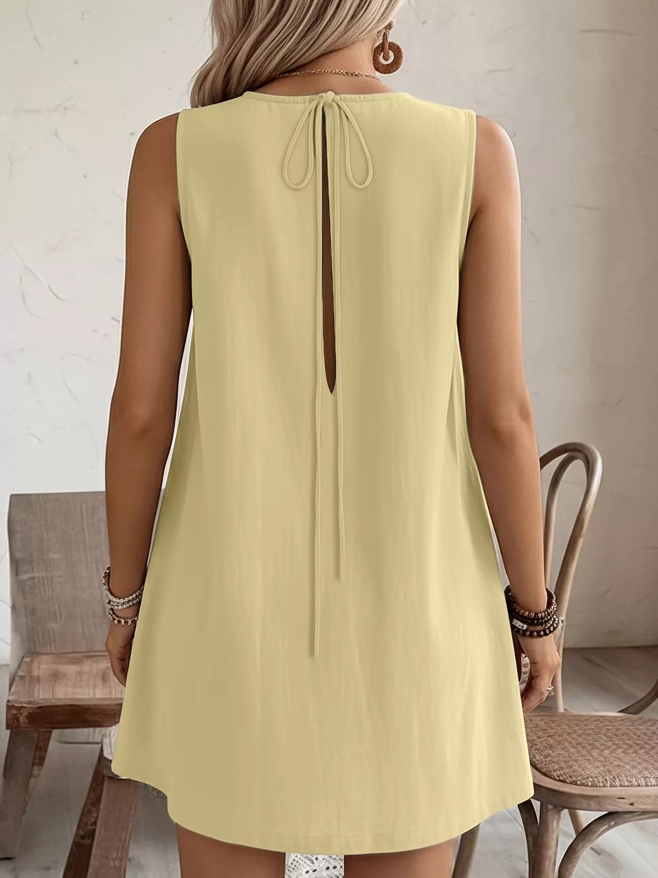Cedar & Moore Frill Sleeveless Round Neck Dress in pale yellow with back tie closure