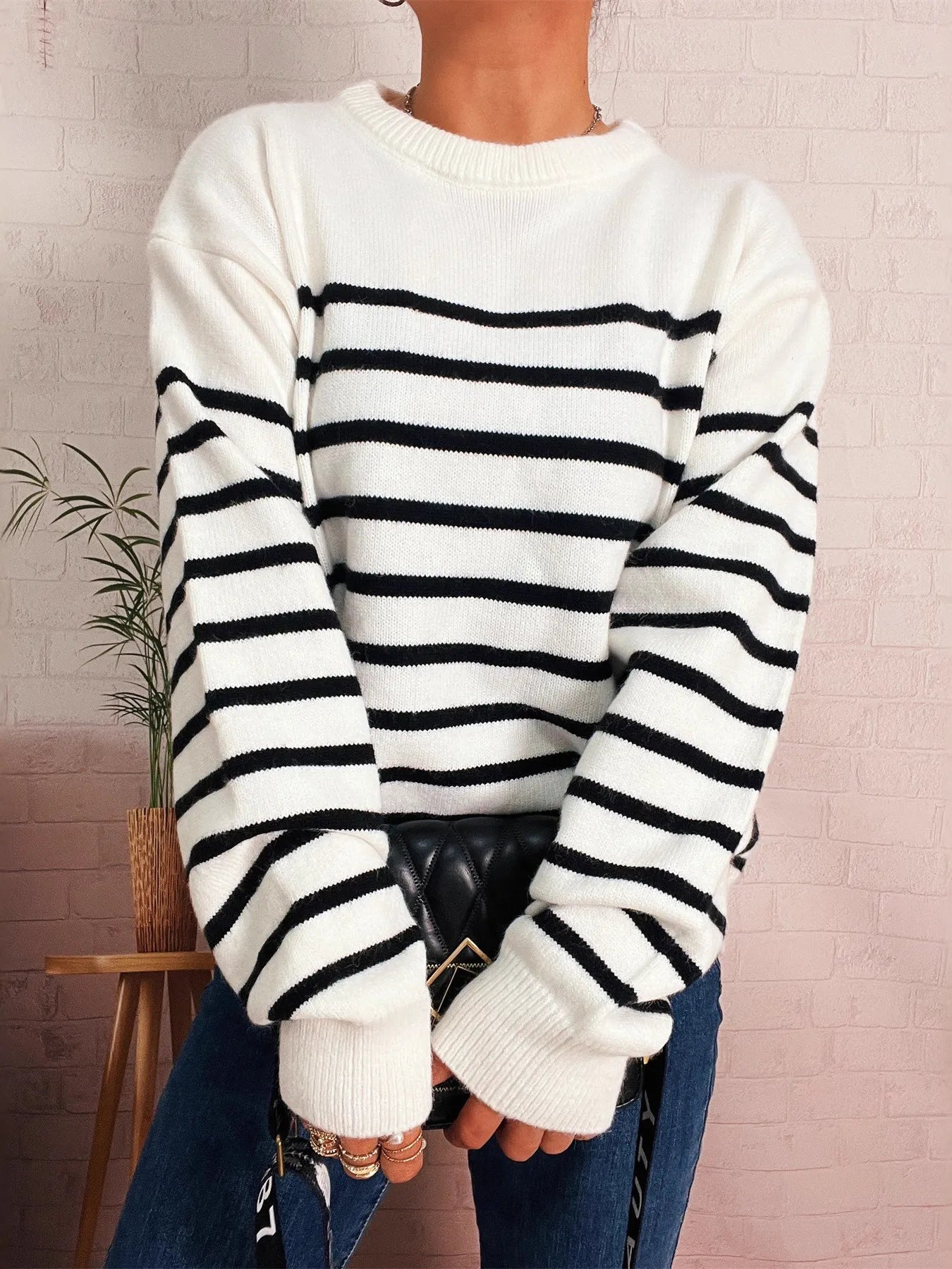 White-and-black striped drop-shoulder sweater with ribbed hem, loose fit