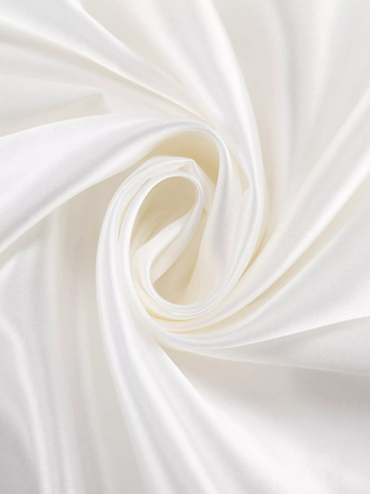 Close-up of white satin fabric with smooth drape and soft sheen