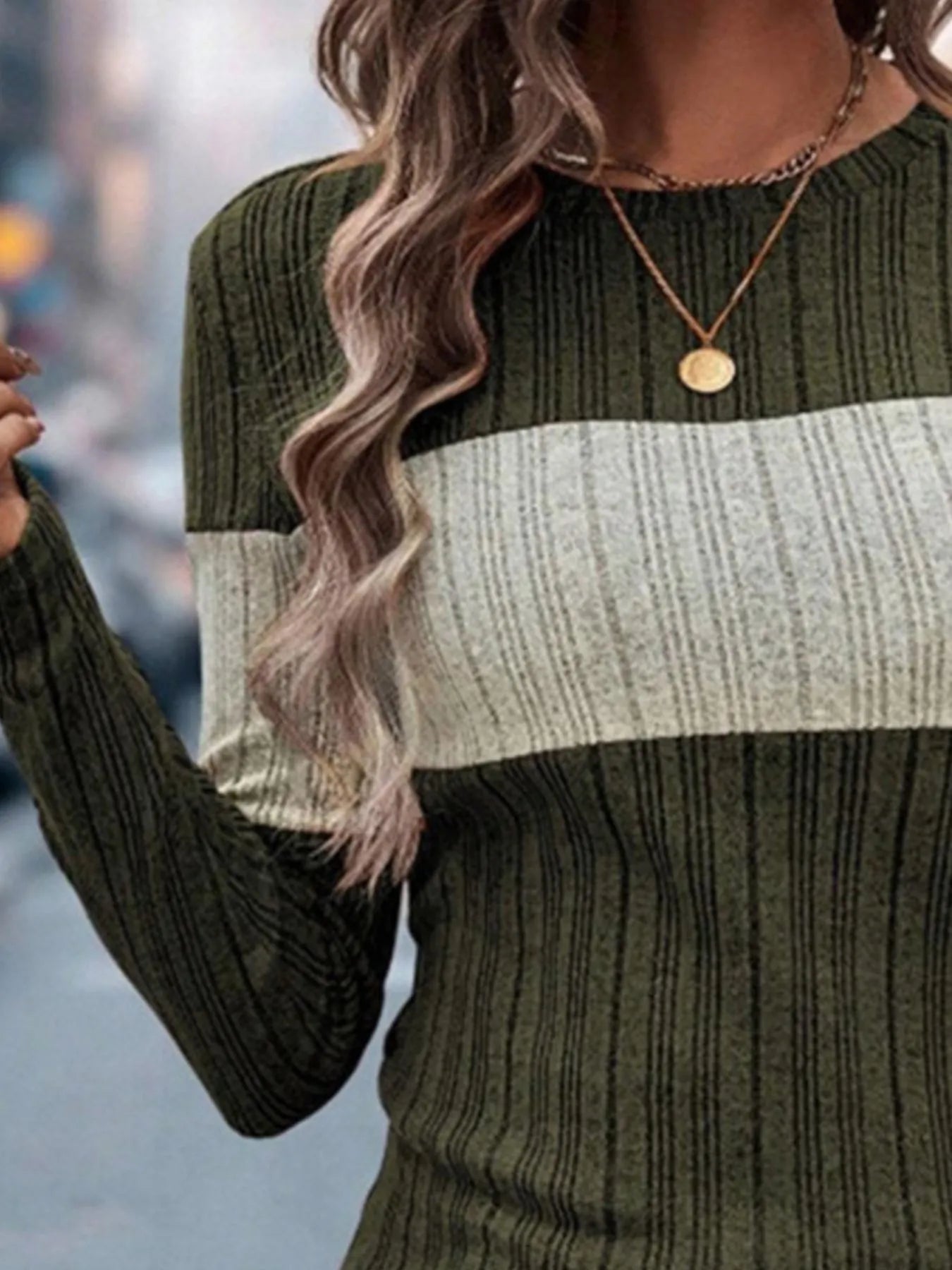 Color-block round-neck long-sleeve sweater in dark green and cream rib knit.