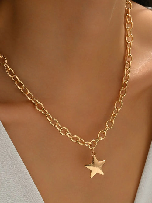 Gold star pendant chain necklace with oval link chain and small center star charm