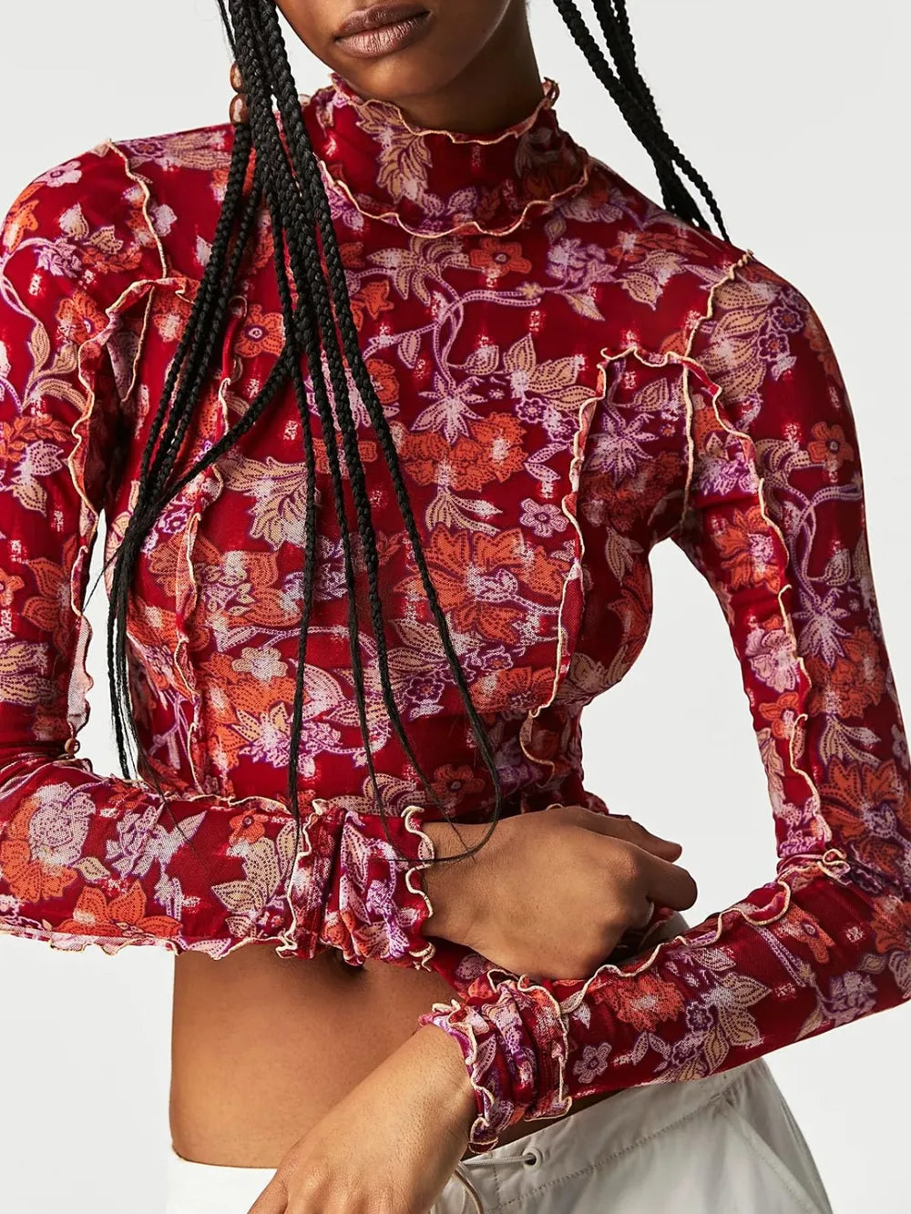 Mock neck floral long-sleeve top in deep red with cream floral print, ruffled trim