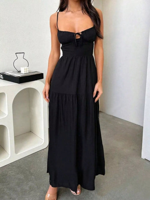 Black spaghetti strap maxi dress with square neckline, lace-up detail at bust, tiered skirt