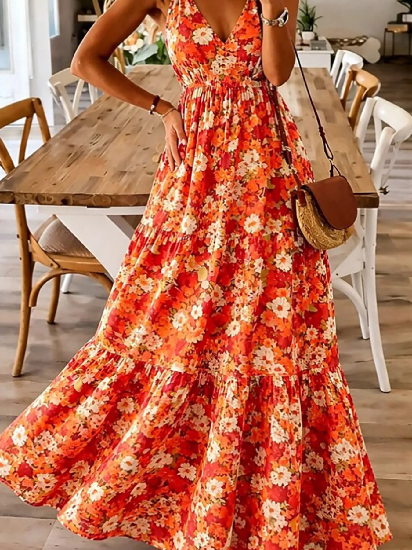 Orange-red floral maxi dress with spaghetti straps and tiered ruffle skirt