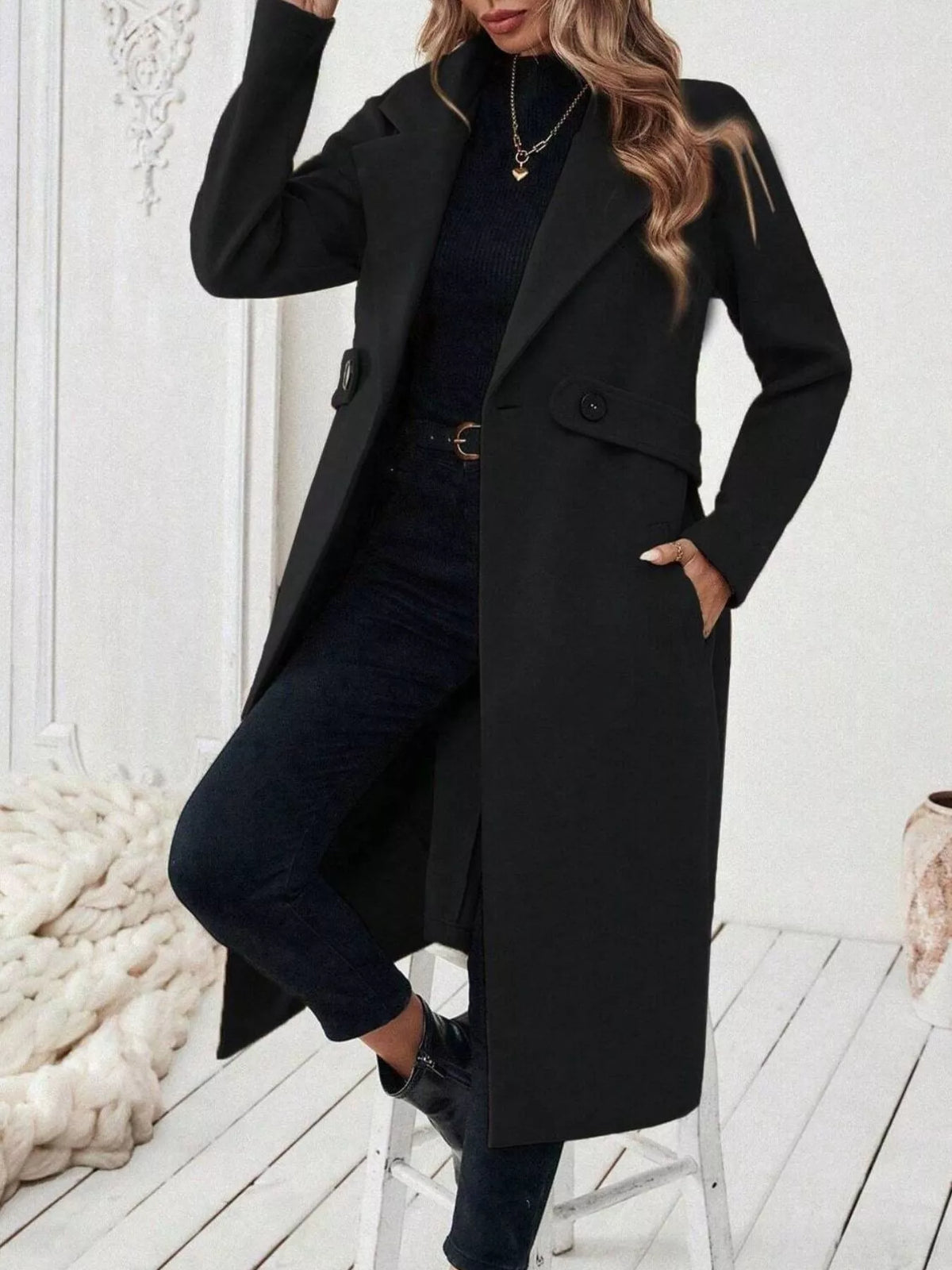 Black lapel longline winter coat with button front and flap pockets