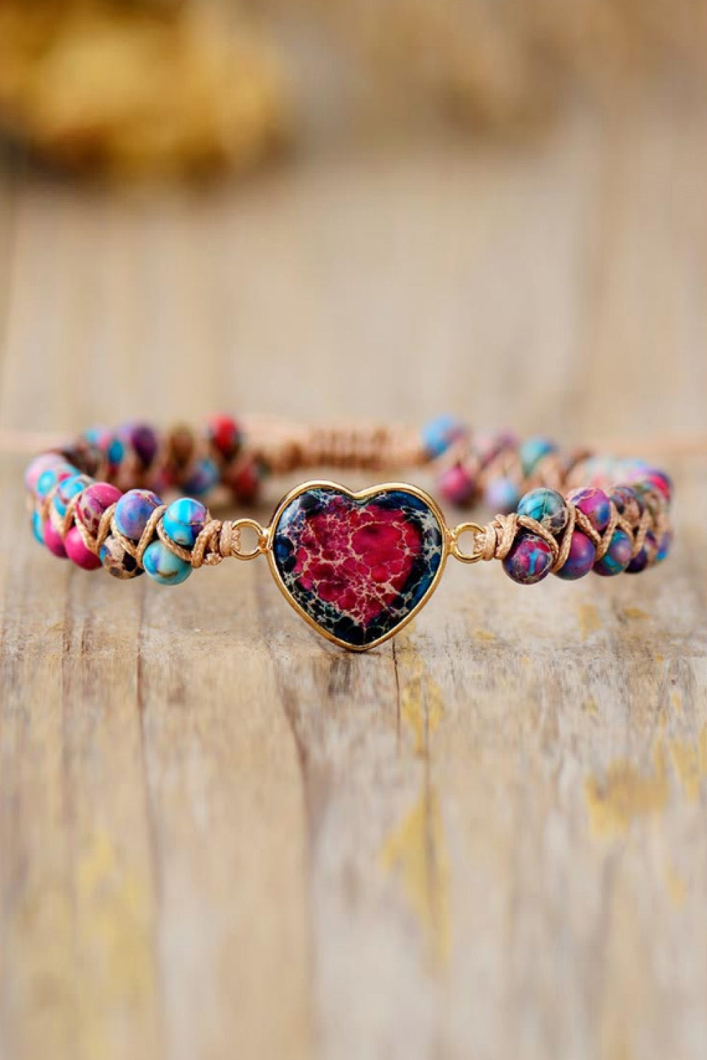 Multicolor beaded bracelet with red heart-shaped stone charm and silver-tone clasp