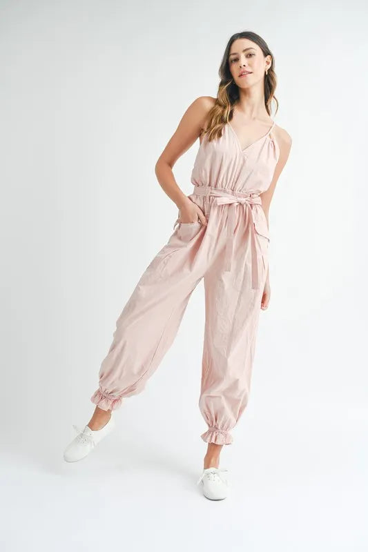 Pink belted spaghetti strap jumpsuit with gathered jogger cuffs