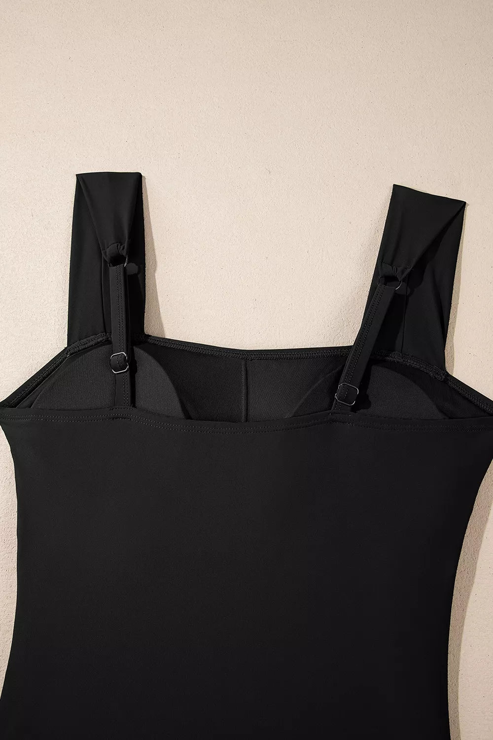 Black square-neck ruched tummy-control one-piece swimsuit with adjustable shoulder straps