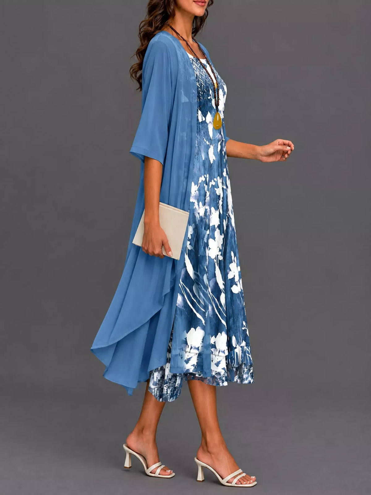 Blue floral print midi dress with sheer chiffon cardigan, side view, draped mid-calf hem