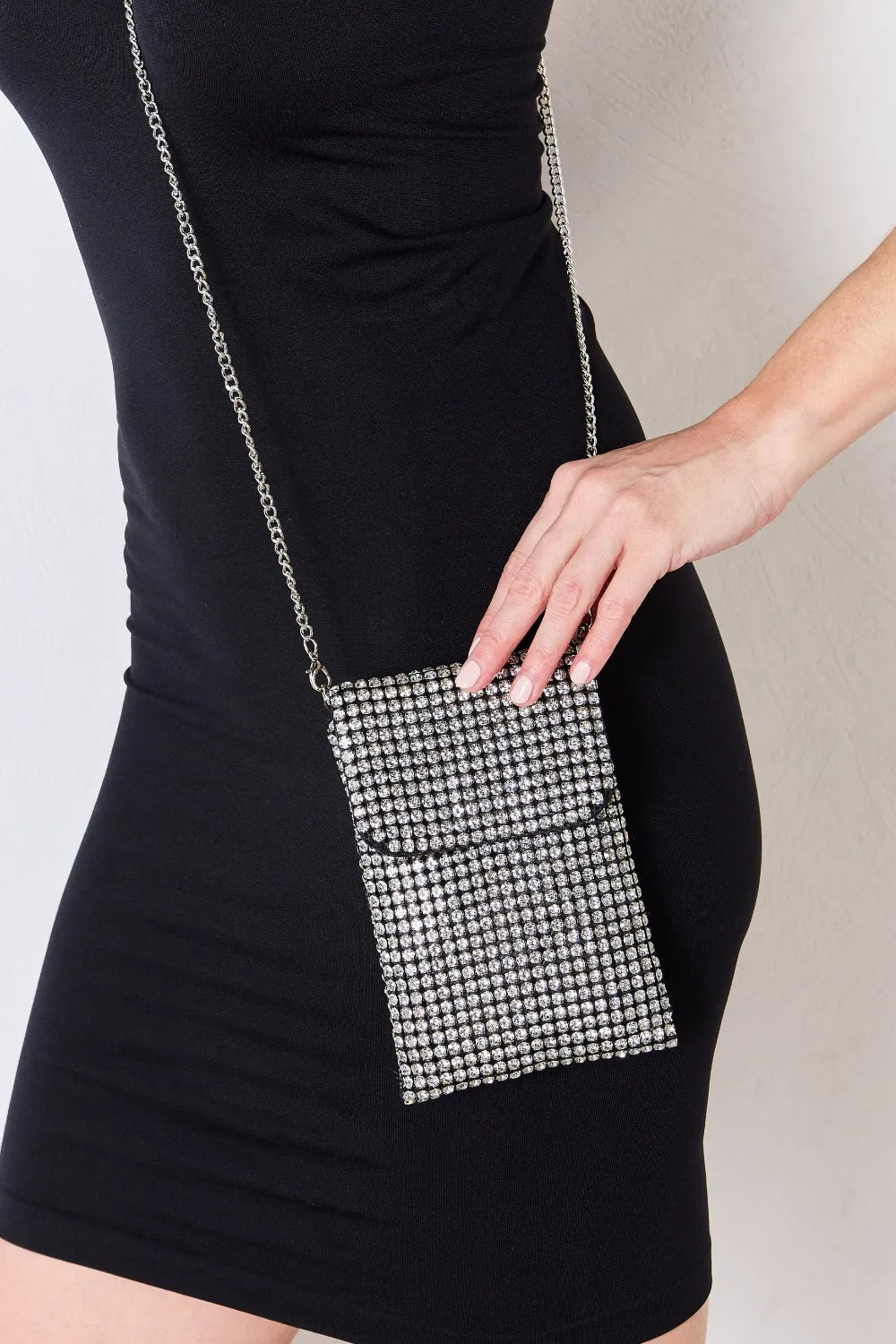 Rhinestone mini crossbody bag with silver chain strap and square sparkly front