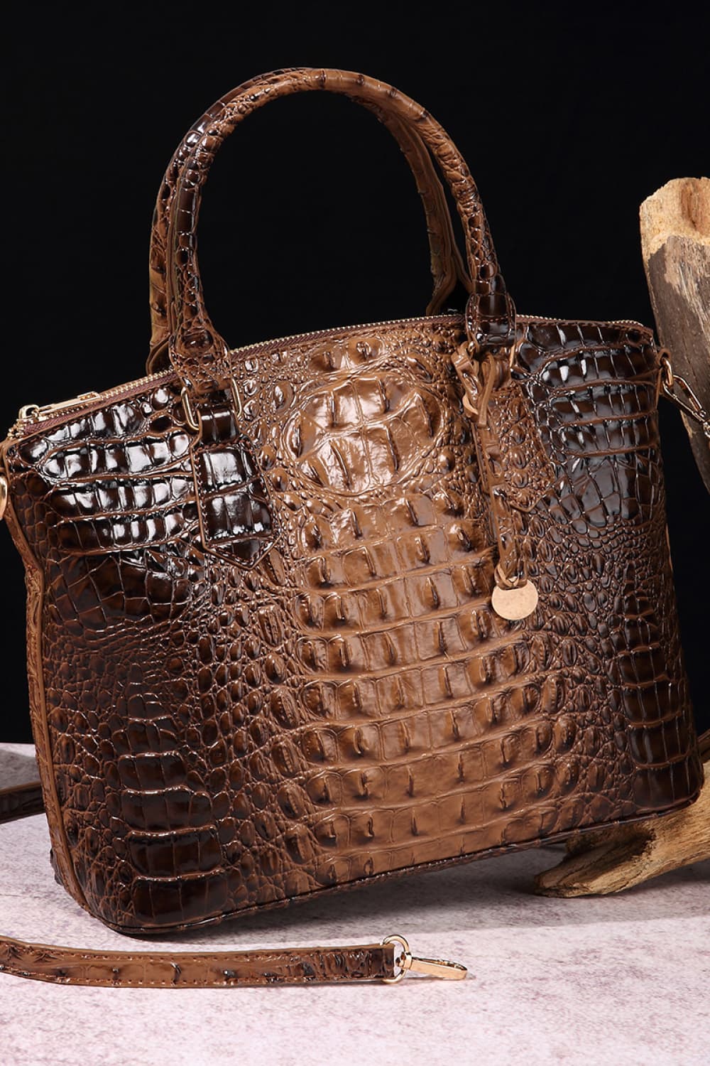 Croc-embossed vegan leather handbag in dark brown with top handles and gold clasp
