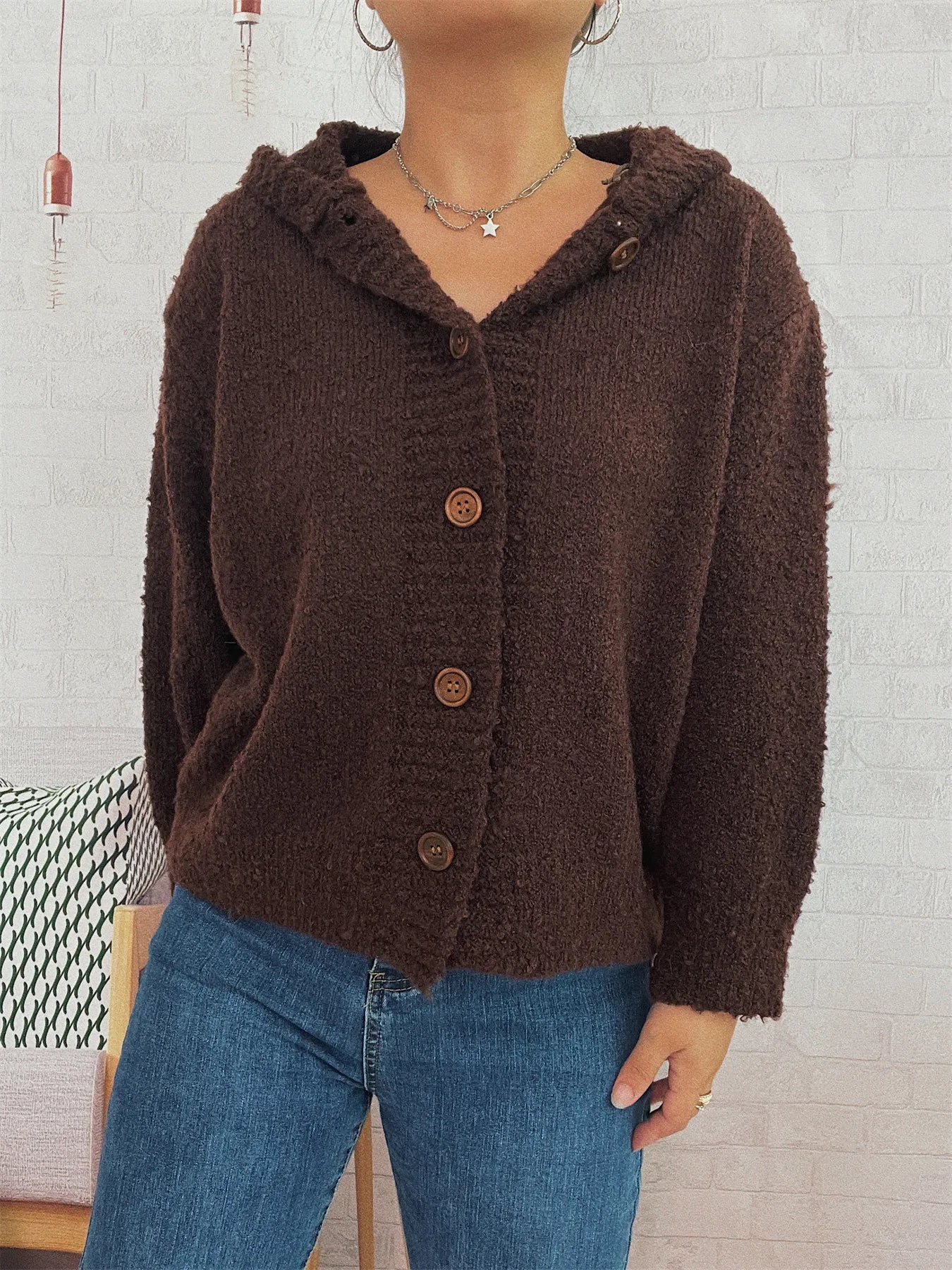 Brown hooded cardigan with long sleeves and button front placket in textured knit