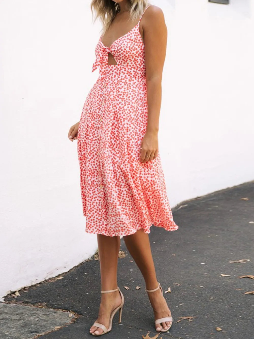 Pink floral cami dress with bow tie sweetheart cutout and tiered flutter skirt, midi