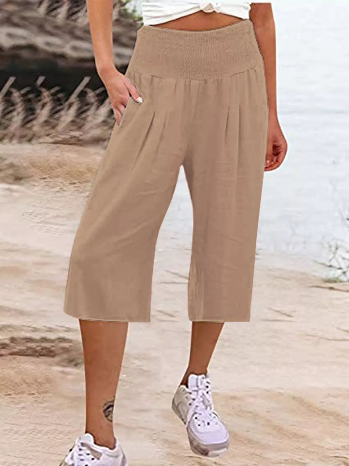 Smocked wide-leg capri pants in tan, gathered elastic waist and wide cropped legs