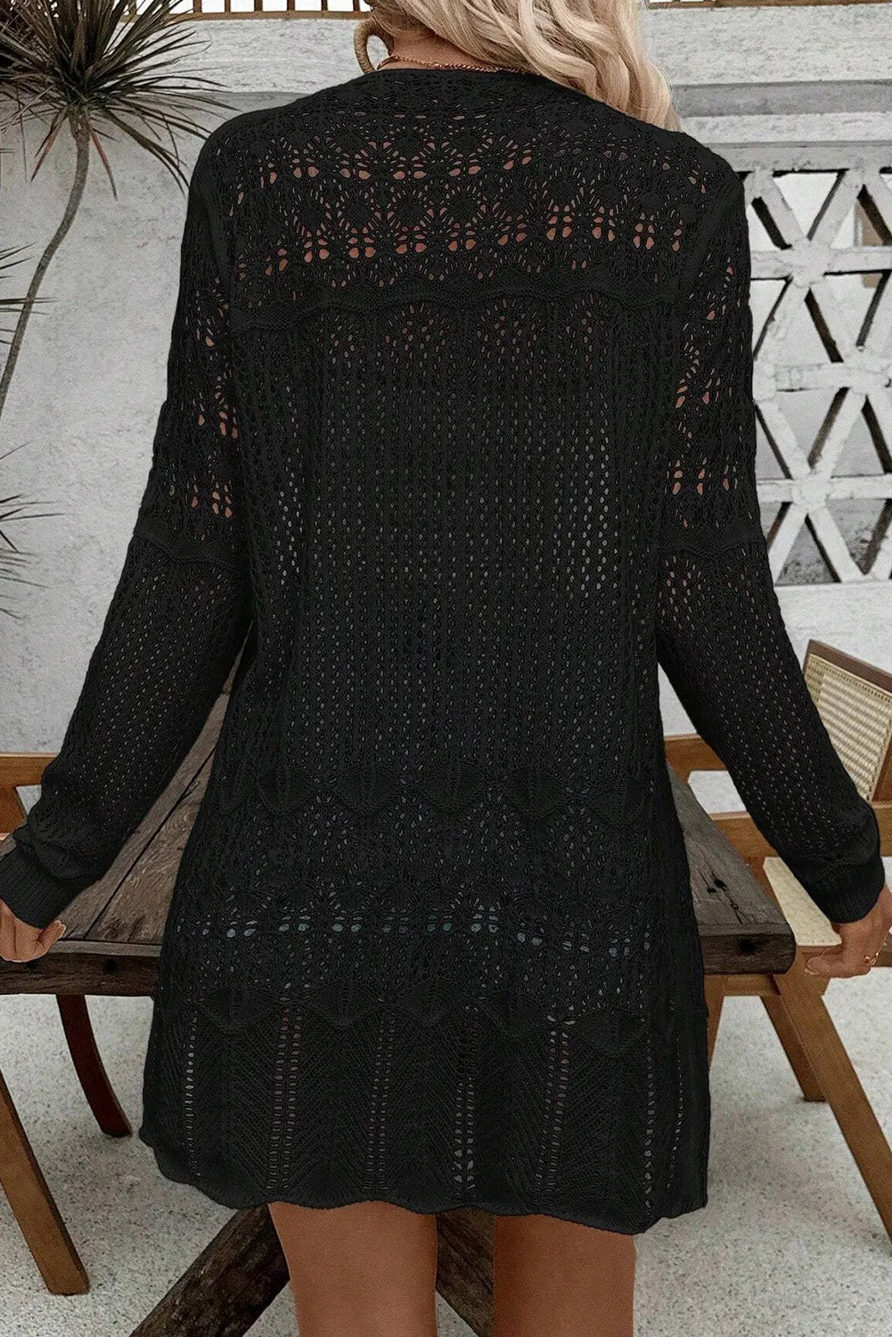 Black long-sleeve openwork cardigan with open-back crochet knit and tunic hem