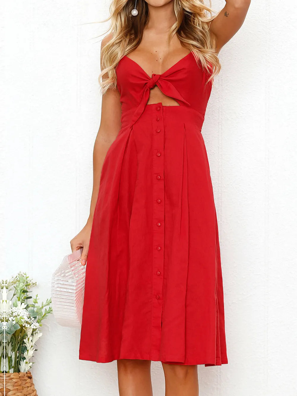 Red cami dress with sweetheart bow cutout and button-front midi skirt