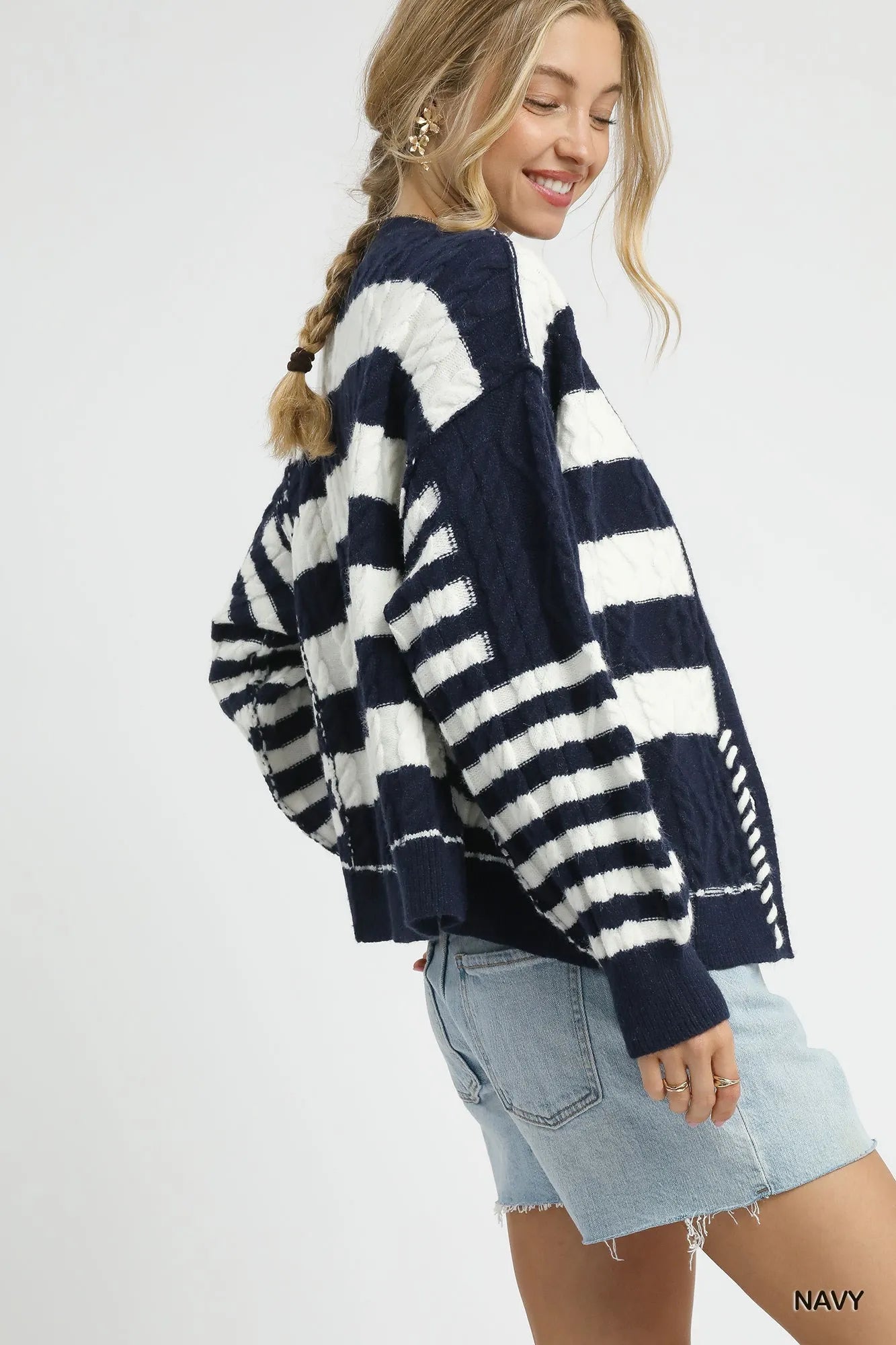 Navy and white striped cable-knit cardigan with button front and long sleeves