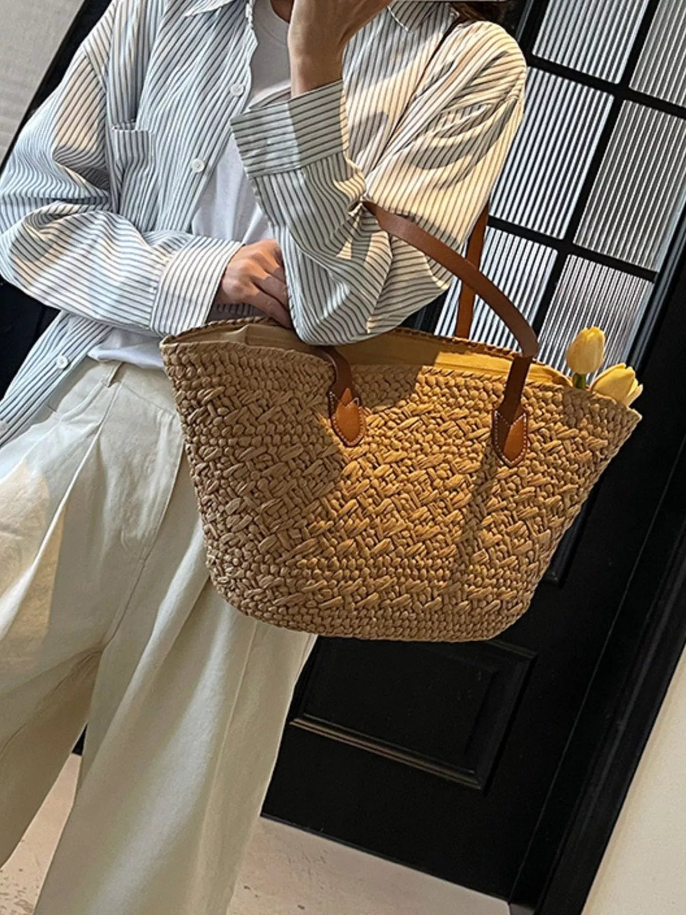 Caramel woven tote shoulder bag with three brown leather handle loops and open top