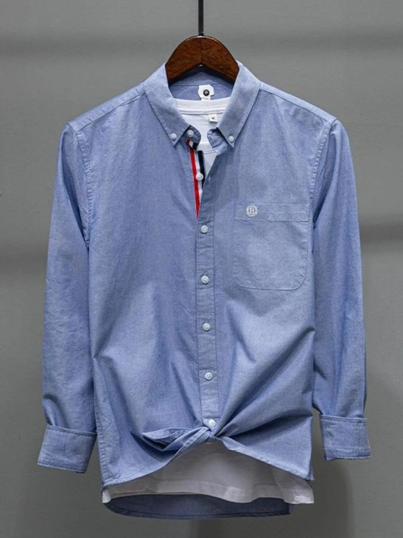 Sky blue button-up long-sleeve shirt with chest pocket and collar