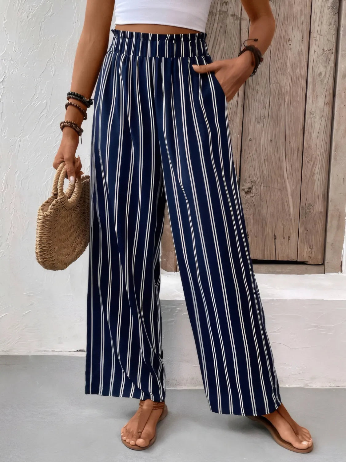 Dark navy striped wide-leg pants with elastic waistband and wide straight legs