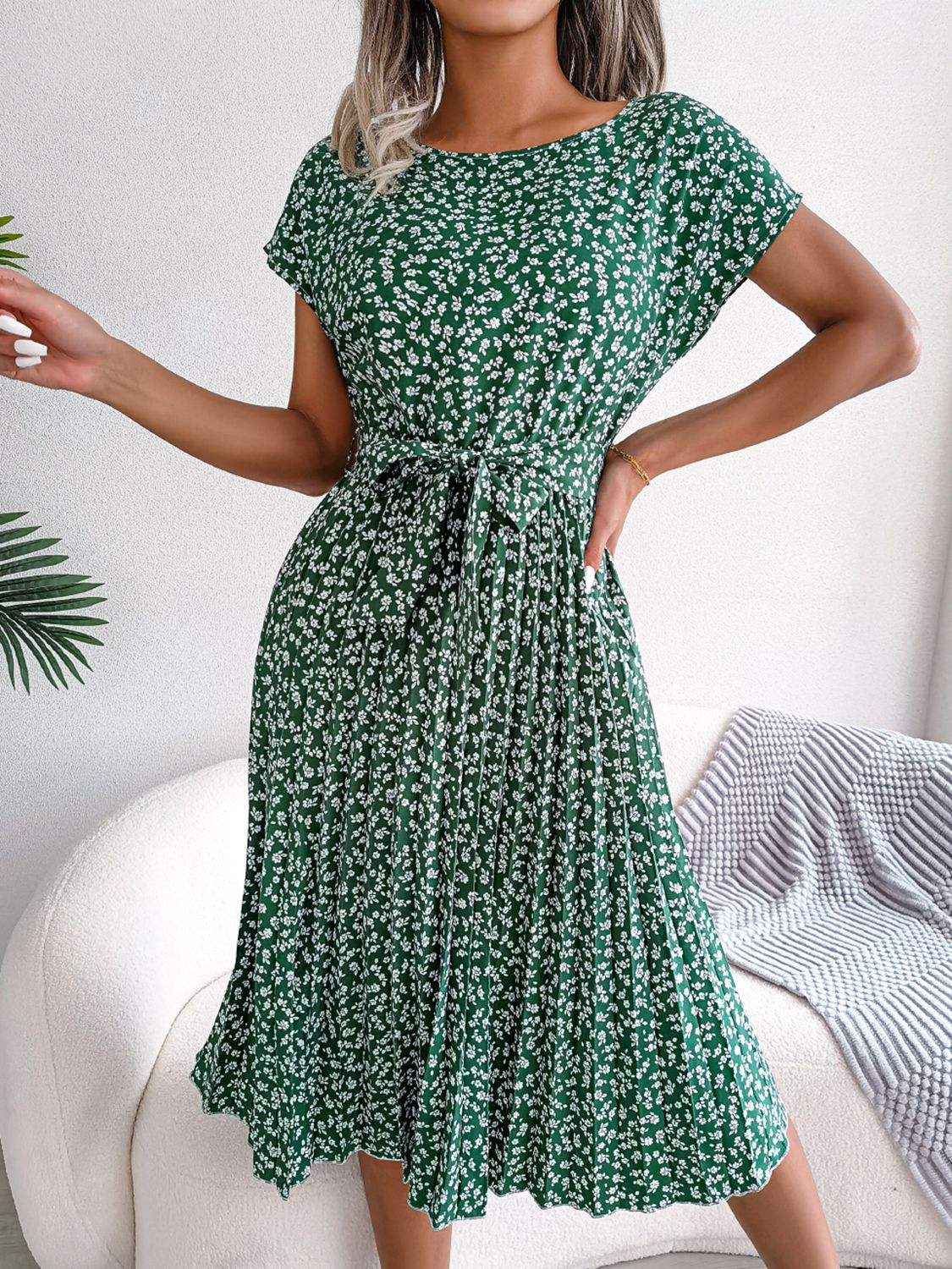 Green ditsy floral pleated belted dress with short sleeves