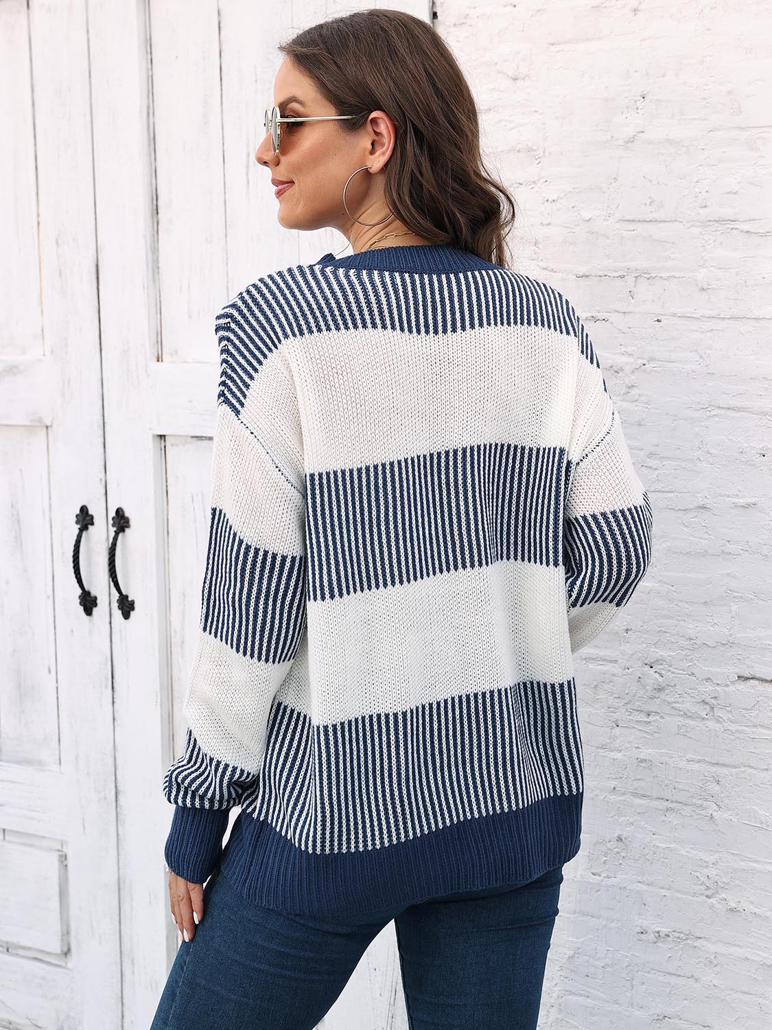 Striped knit sweater back view with round neck, drop-shoulder long sleeves in navy and white