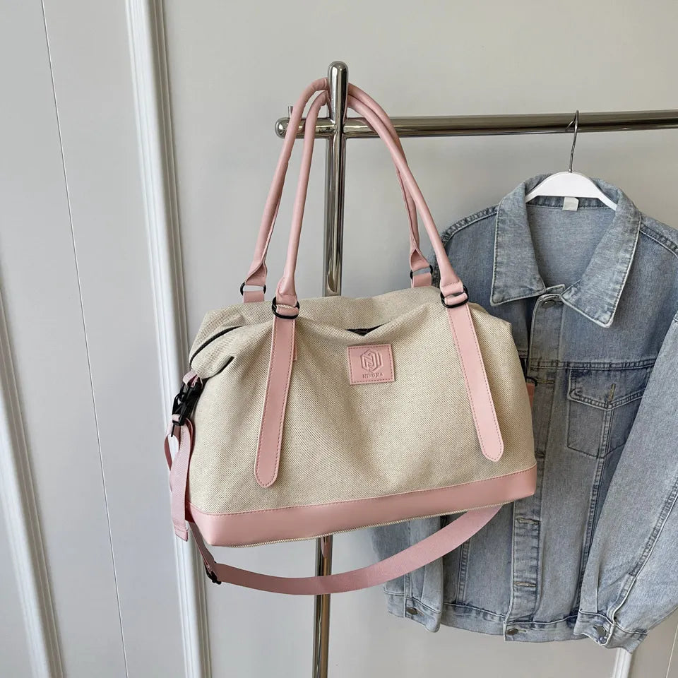 Large polyester duffle bag in beige with blush pink handles and front zipper
