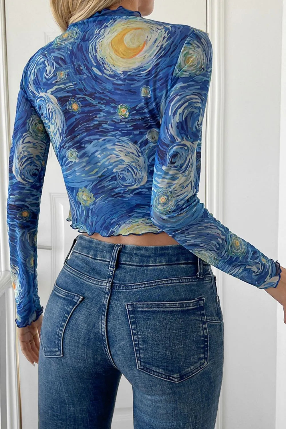 Cropped mesh t-shirt back view in blue with yellow swirl print, long sleeves