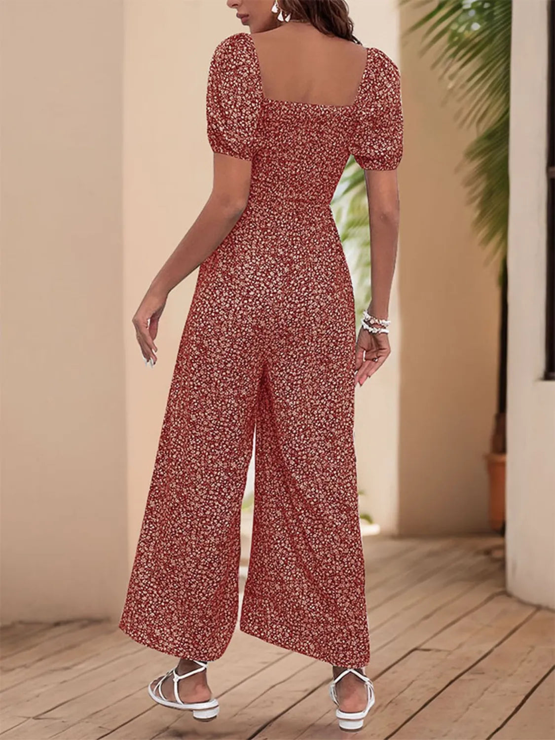 Maroon printed square-neck puff sleeve wide-leg jumpsuit, back view