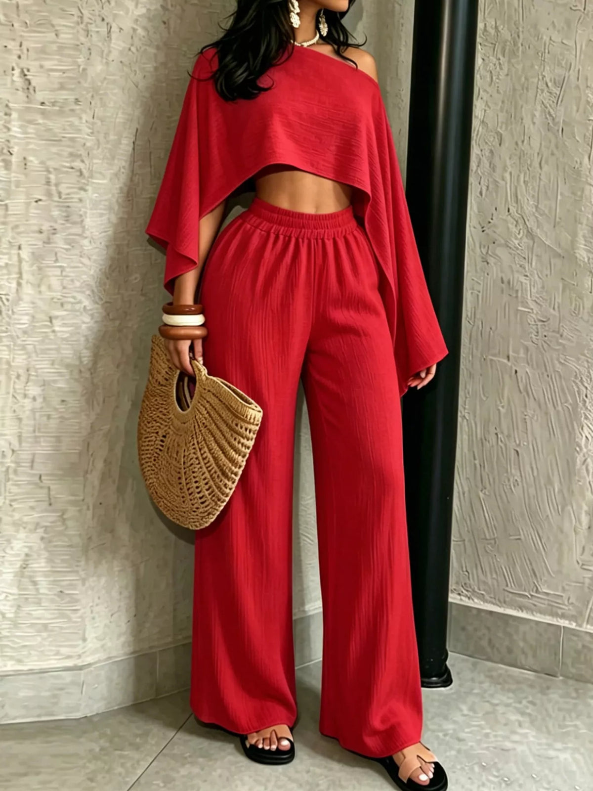 Red boat-neck crop top and wide-leg pants set with draped sleeves
