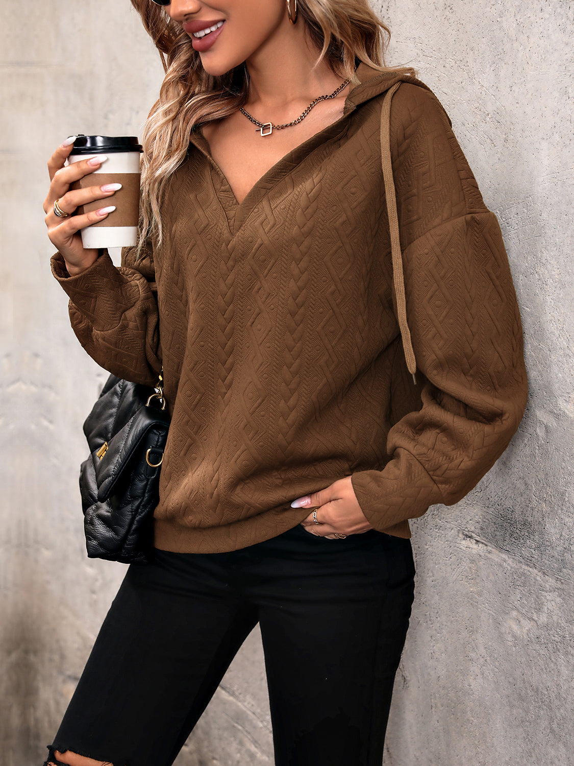 Chestnut brown long-sleeve hoodie with V-neck, hood drawstring, textured pattern