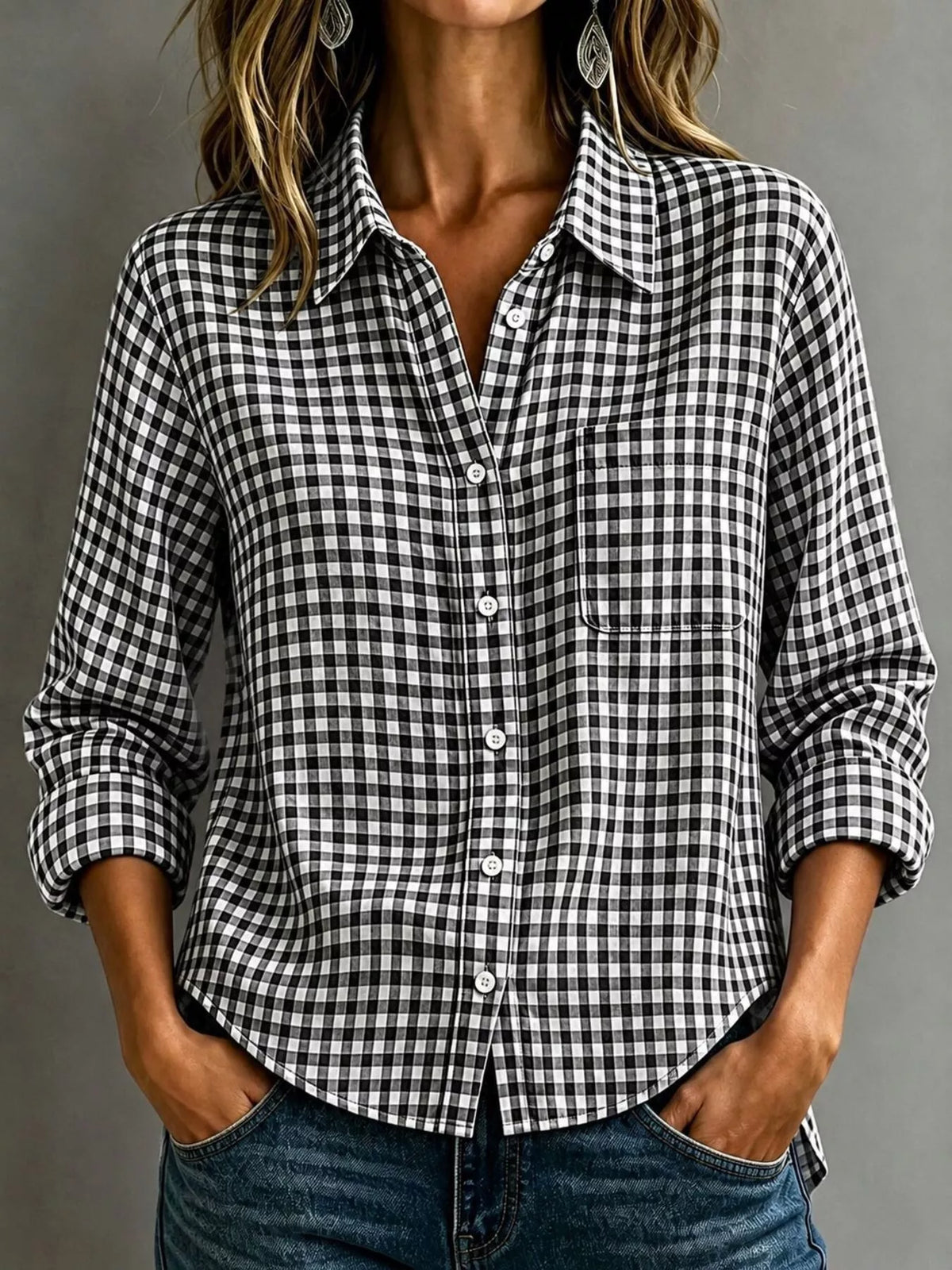 Black-and-white gingham button-down shirt with chest pocket, long sleeves, and button front.
