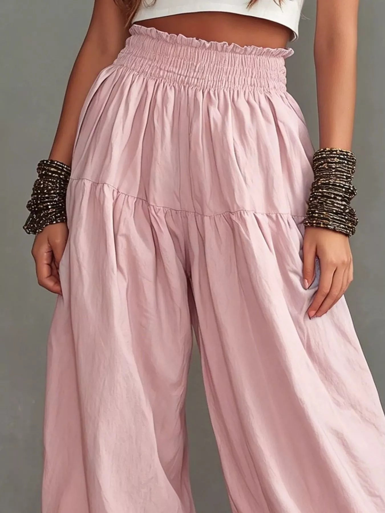 Blush pink smocked wide-leg pants with tiered gathered front