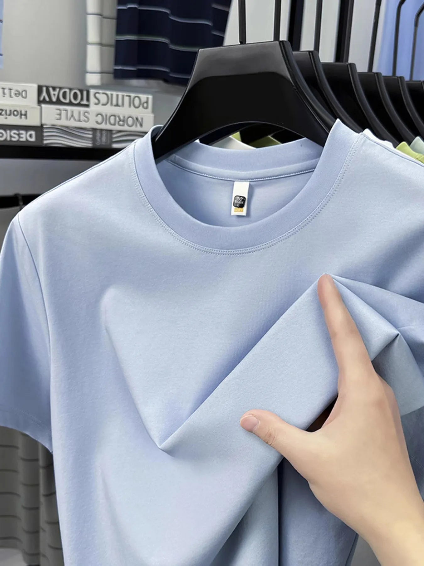 Men's round-neck short-sleeve T-shirt, light blue with tag detail