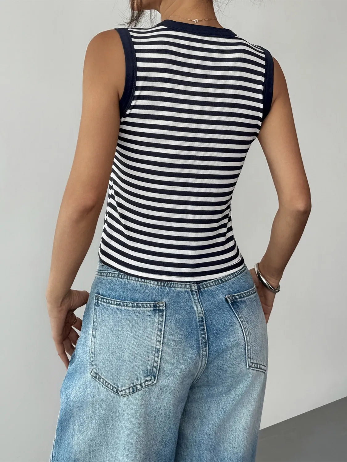 Navy and white striped sleeveless round-neck tank top, back view