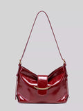 Wine red gloss vegan leather crescent shoulder bag with magnetic snap and strap