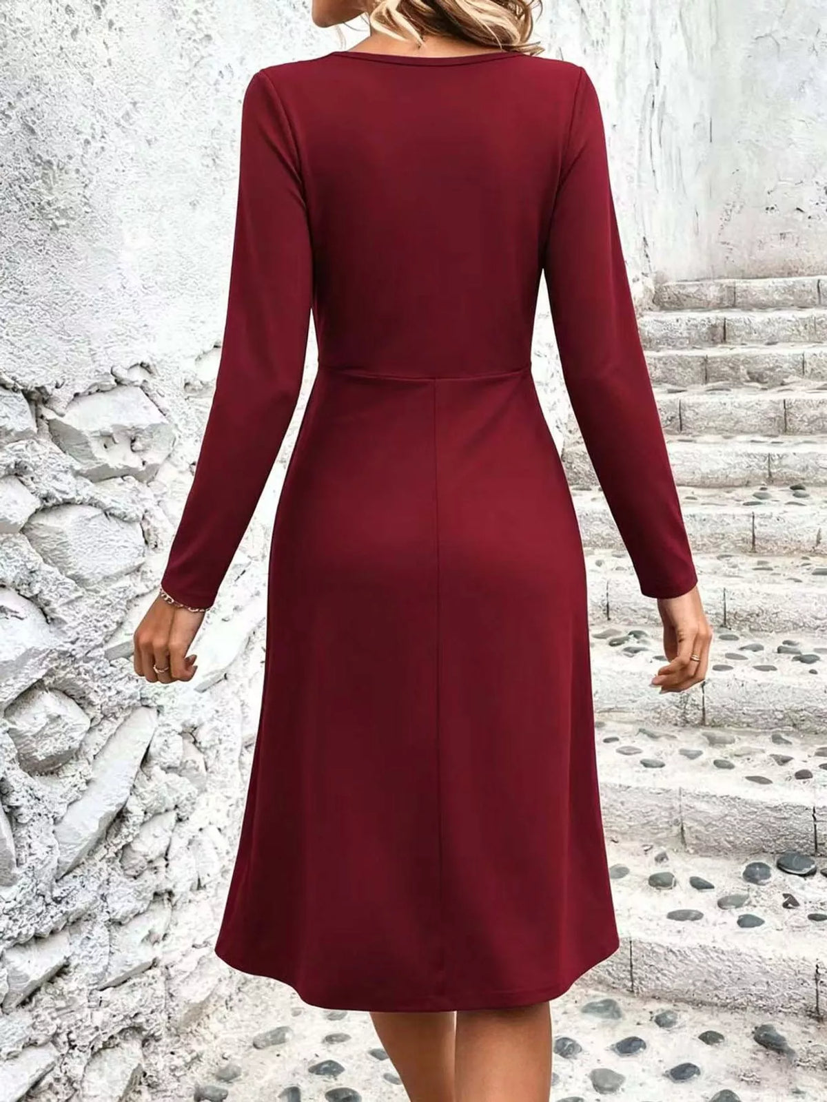Burgundy ruched midi dress with crisscrossed V-neck and long sleeves