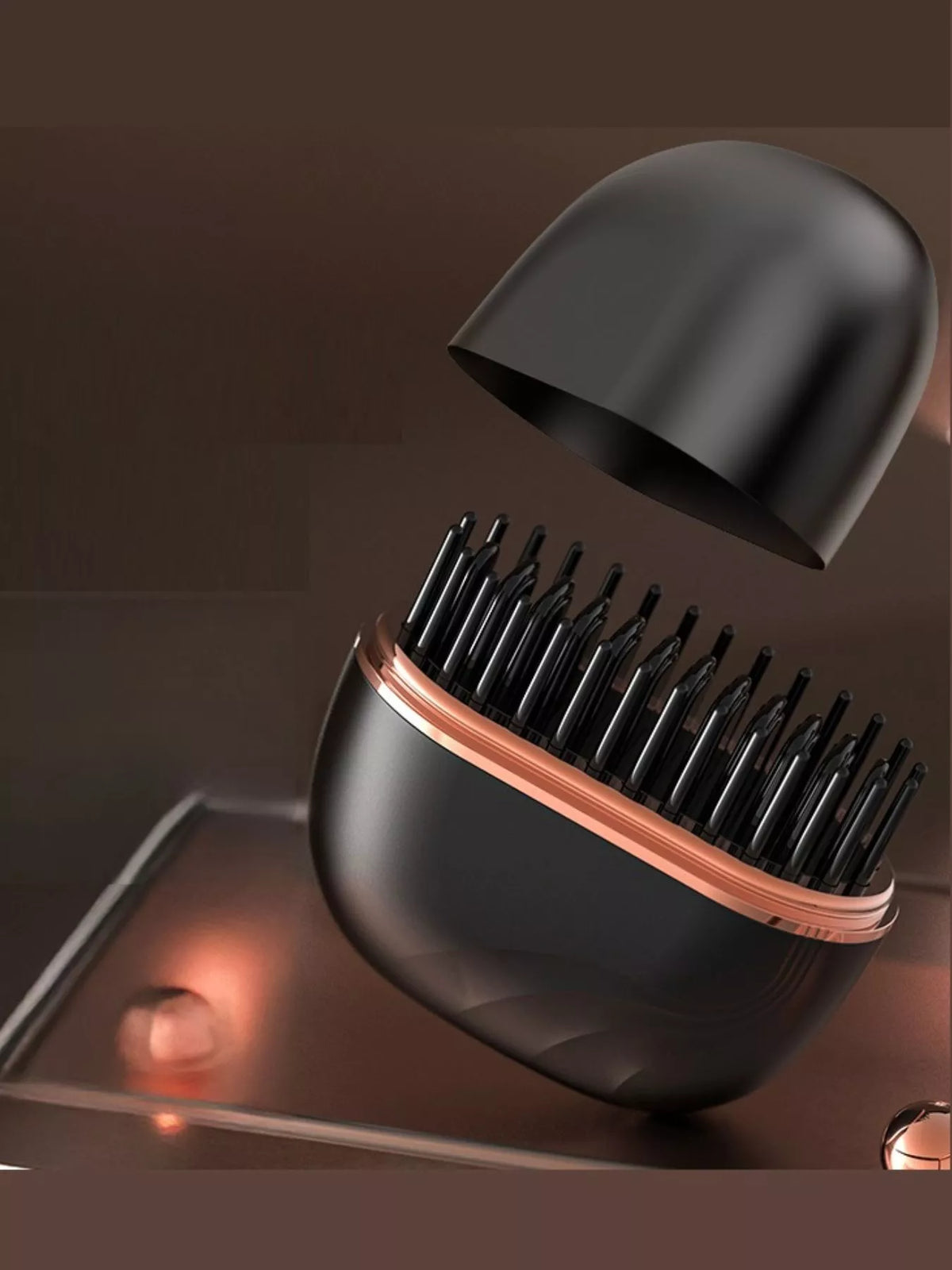 Black rechargeable hair straightening comb with rose-gold trim and black teeth