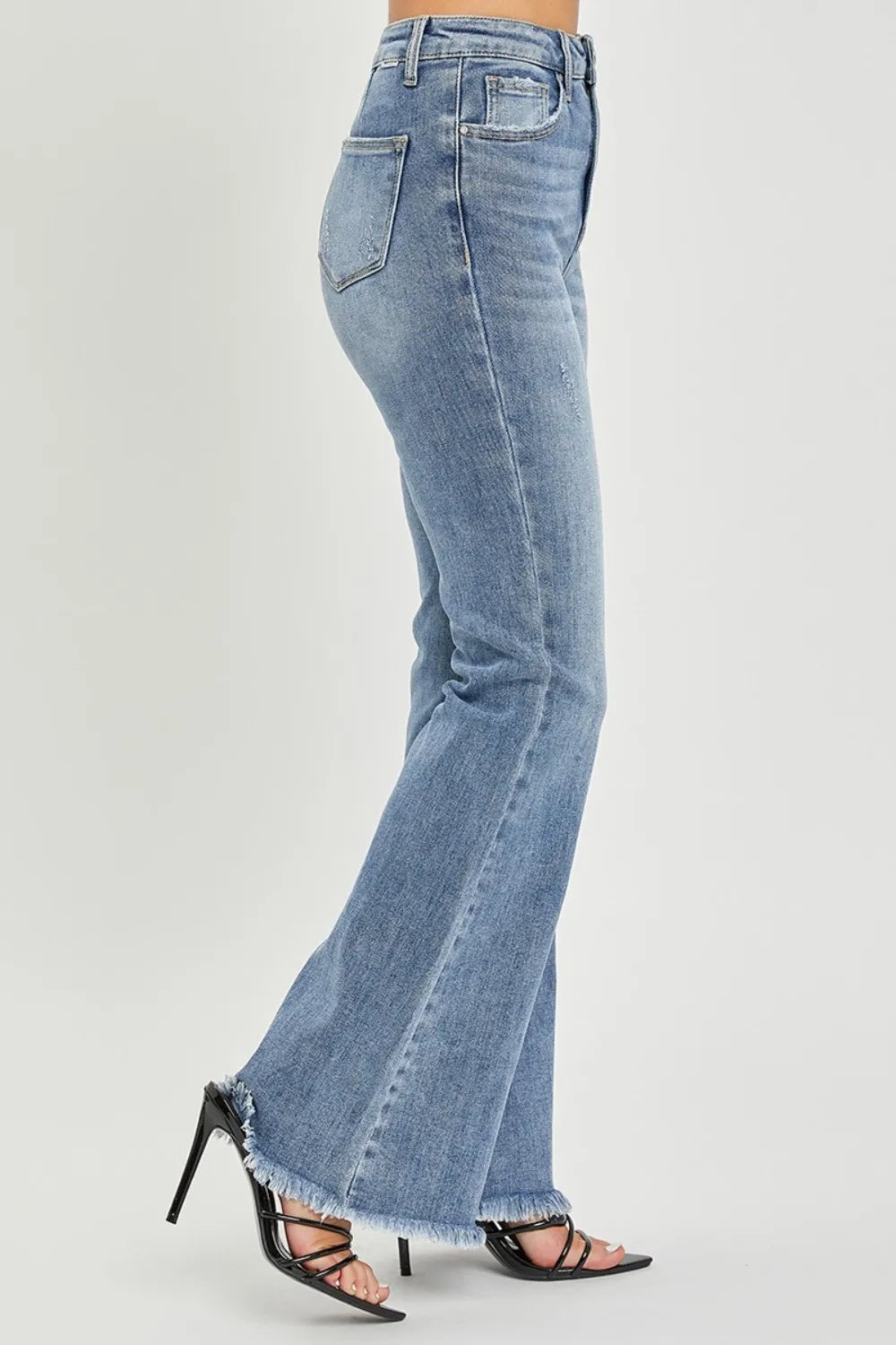 High-waist flare jeans in medium blue wash with raw cuff hem and belt loops
