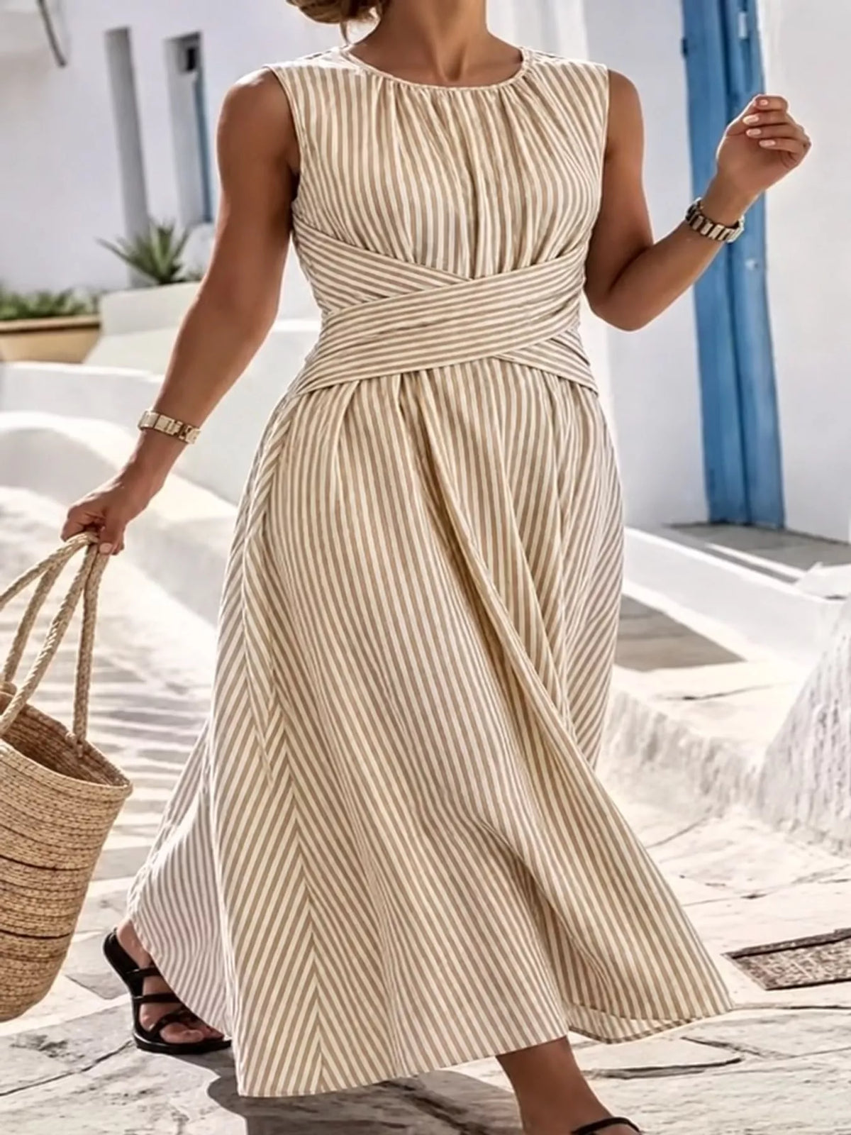 Beige striped sleeveless maxi dress with crisscross waist and flared mid-calf length