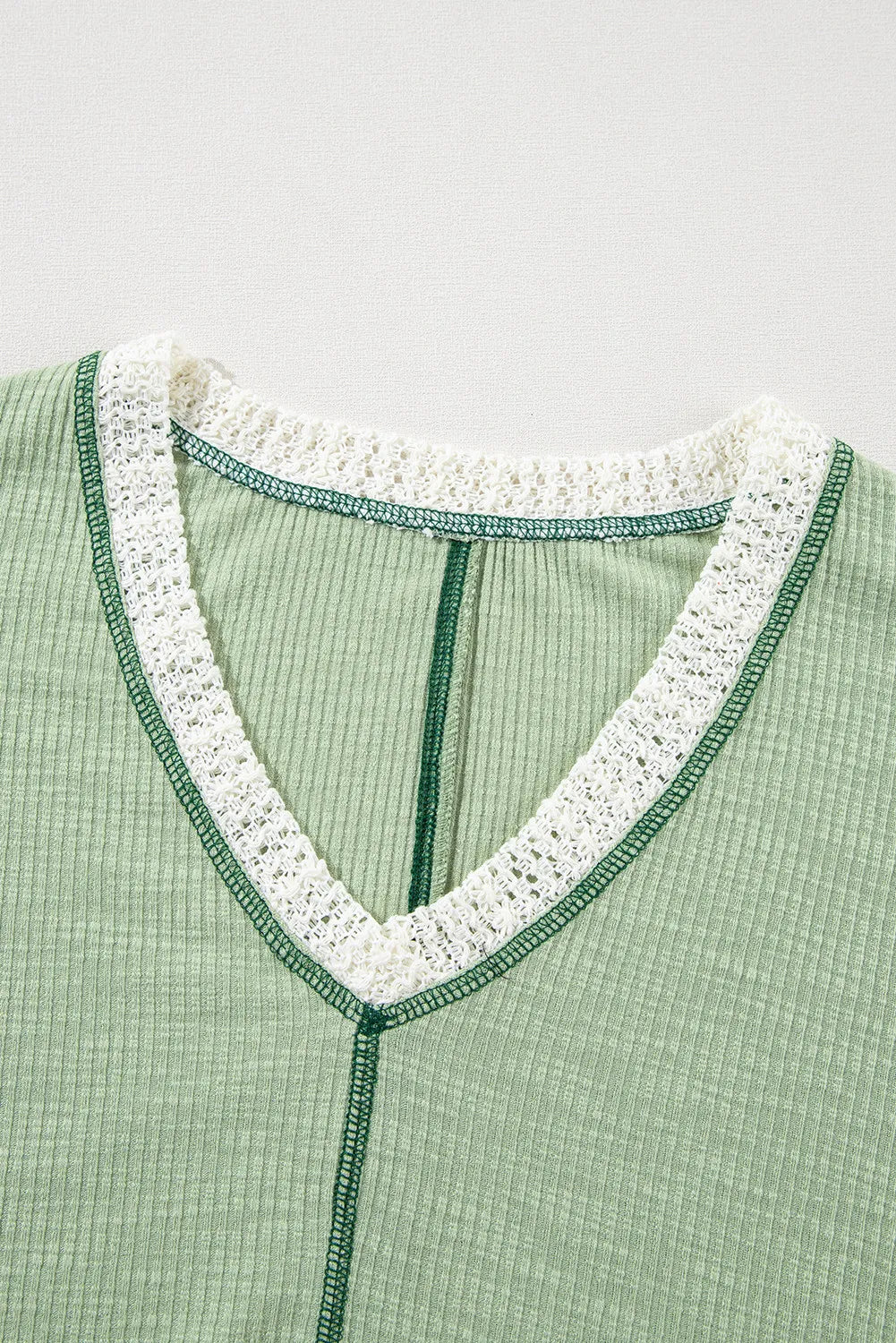 Gum Leaf V-neck lace trim blouse with contrast edging and split neckline placket
