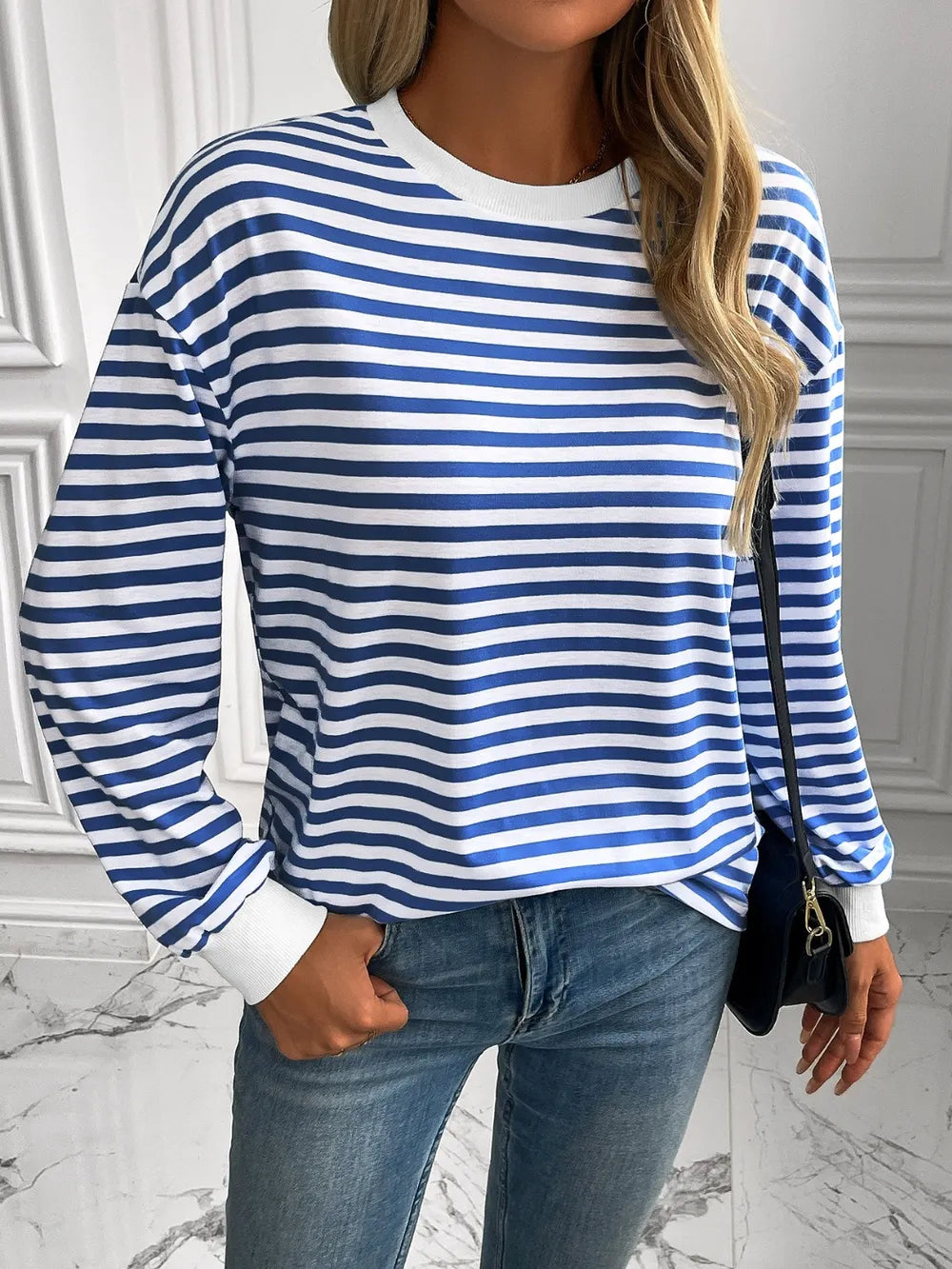 Striped crewneck long-sleeve sweatshirt in blue and white, front view