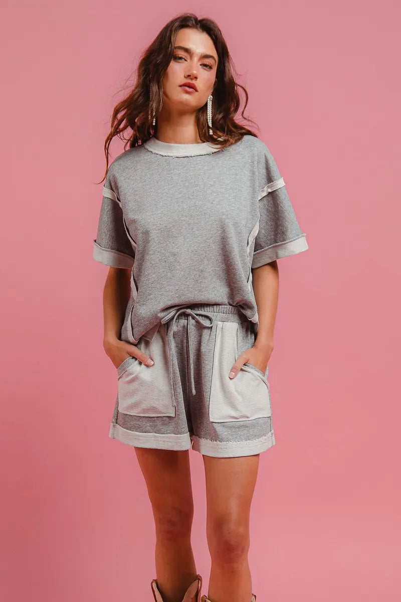 Heather grey knit shorts with drawstring waist and side pockets, cuffed hem