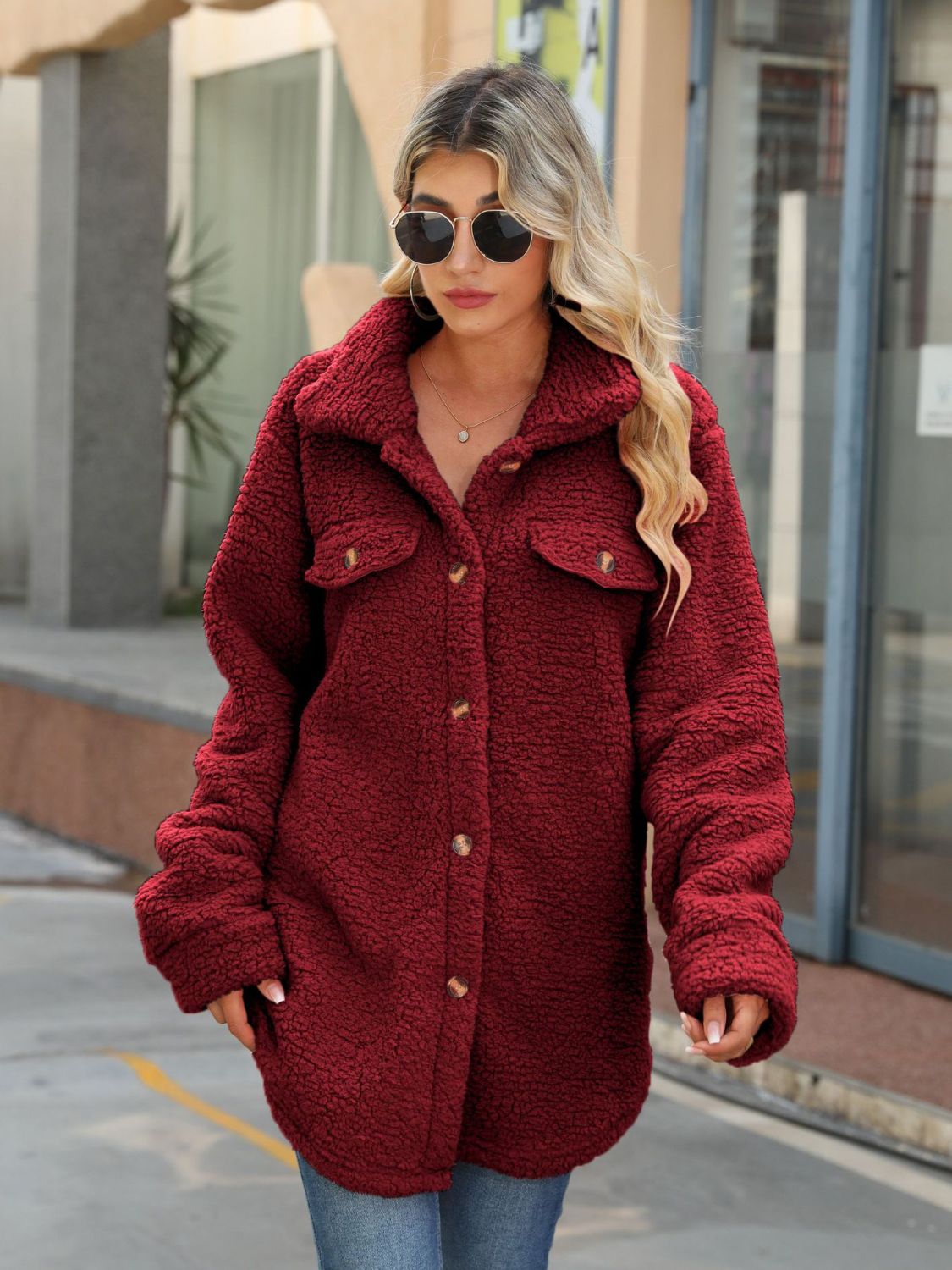 Wine red button-up collared coat with dual chest pockets and front buttons