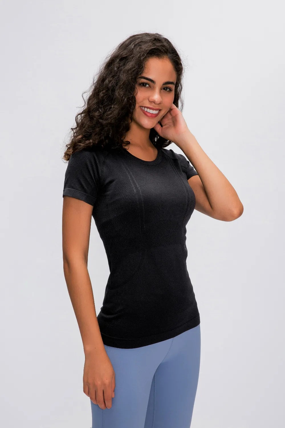 Black round-neck short-sleeve active t-shirt with fitted silhouette.