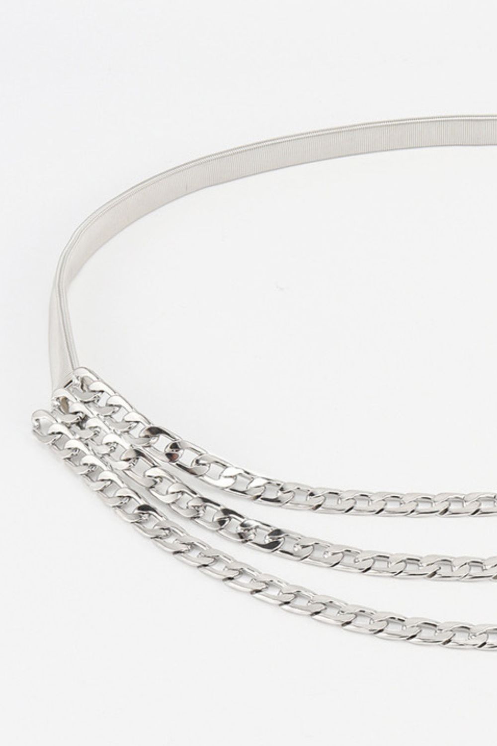 Silver triple-layer chain belt close-up with three interlinked chain rows
