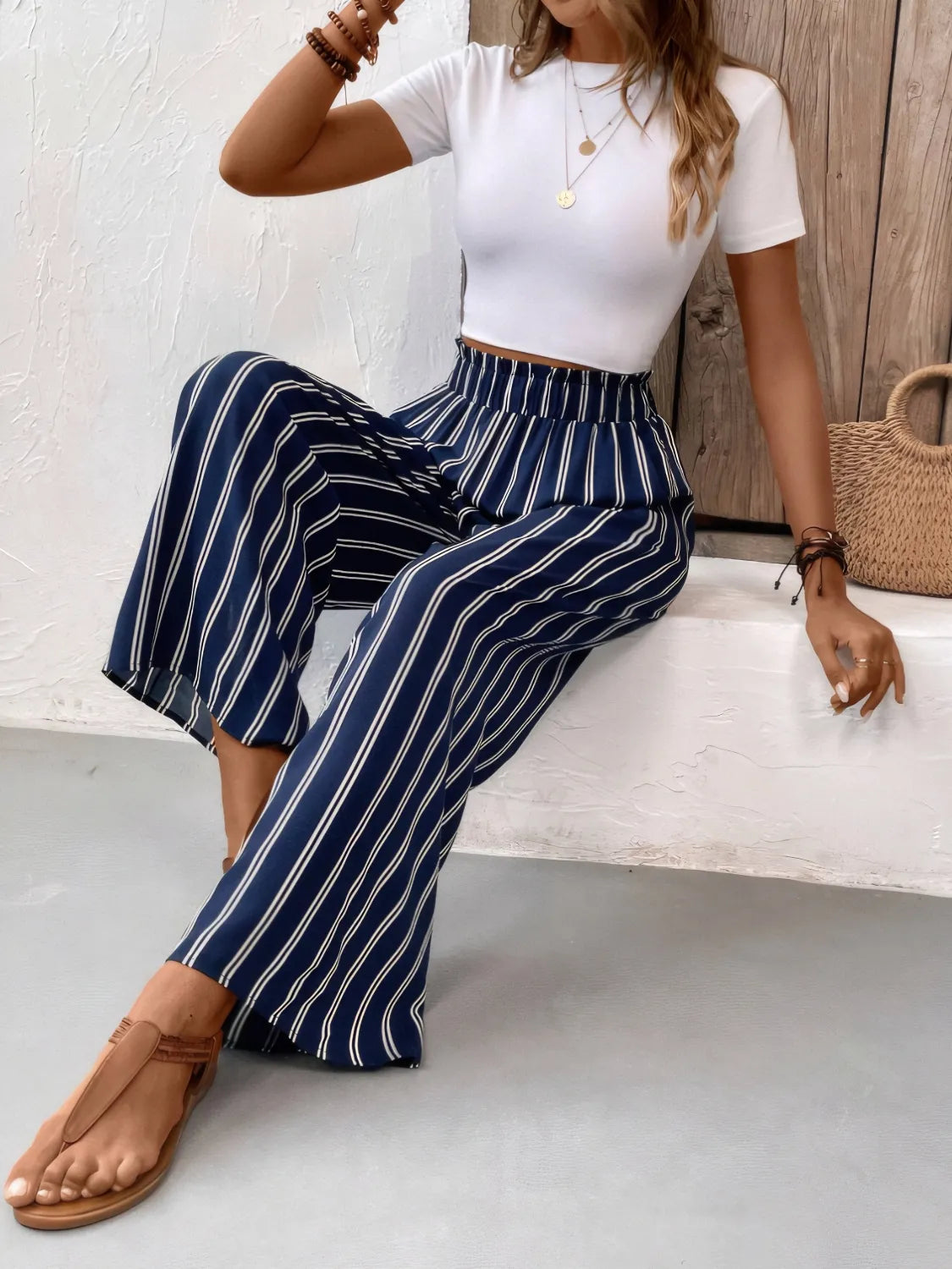 Dark navy striped wide-leg pants with elastic waistband and flowy wide legs