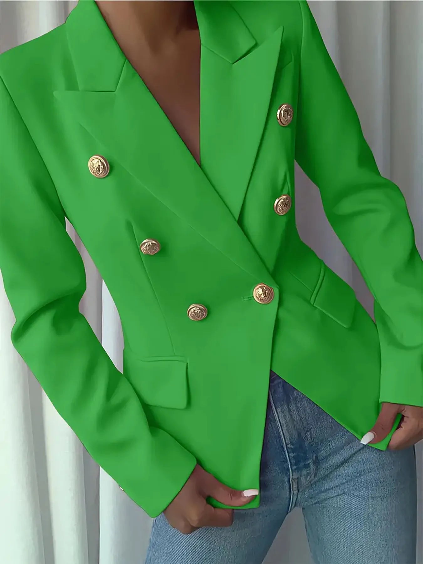 Green blazer with deep V lapel and gold-tone coin-style buttons; long sleeves