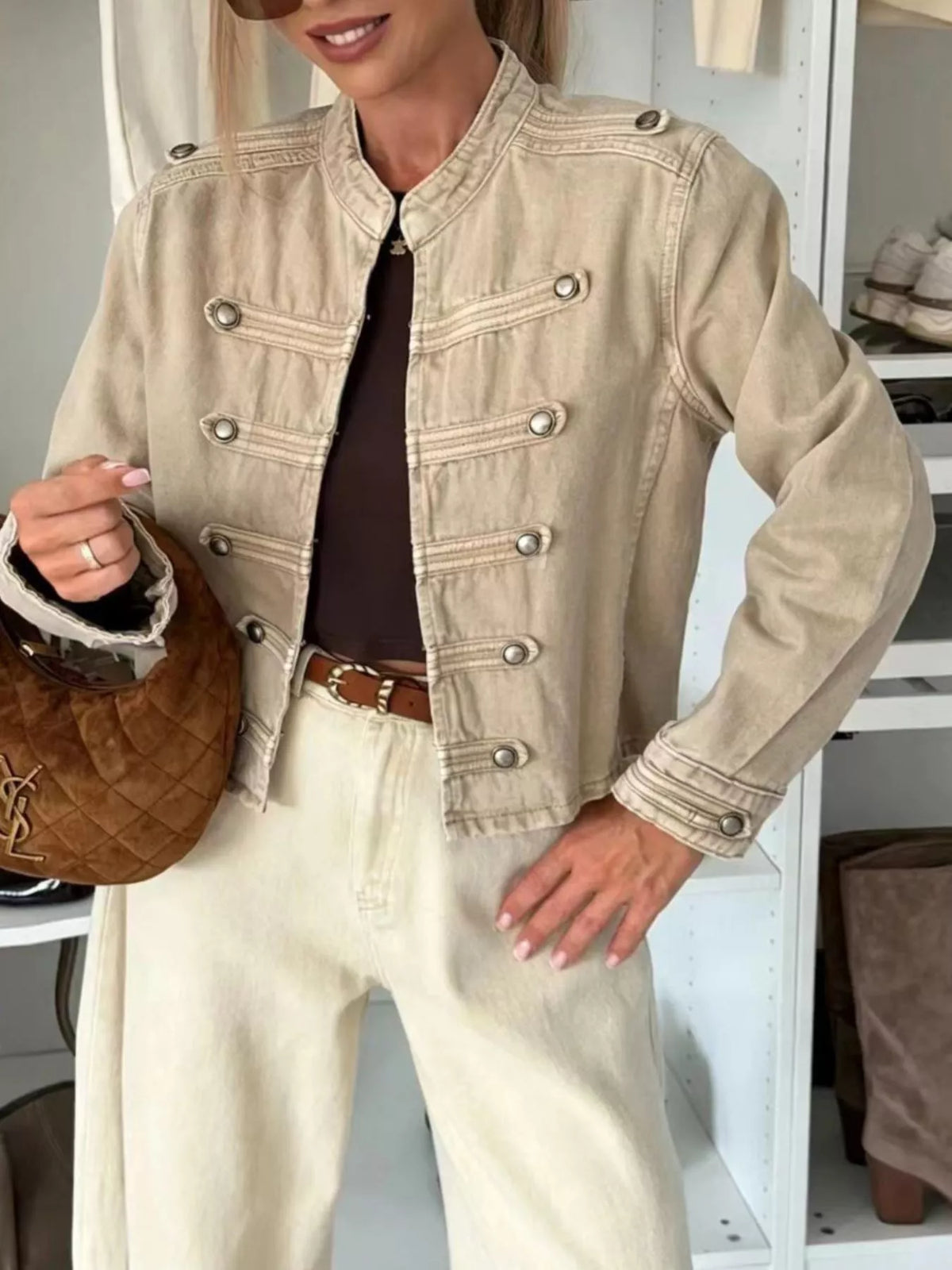 Cropped beige denim jacket with button-front, chest flap pockets, and long sleeves